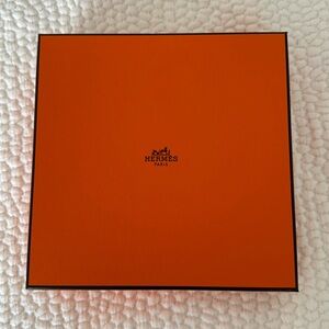 Authentic Hermes box with paper and ribbon.